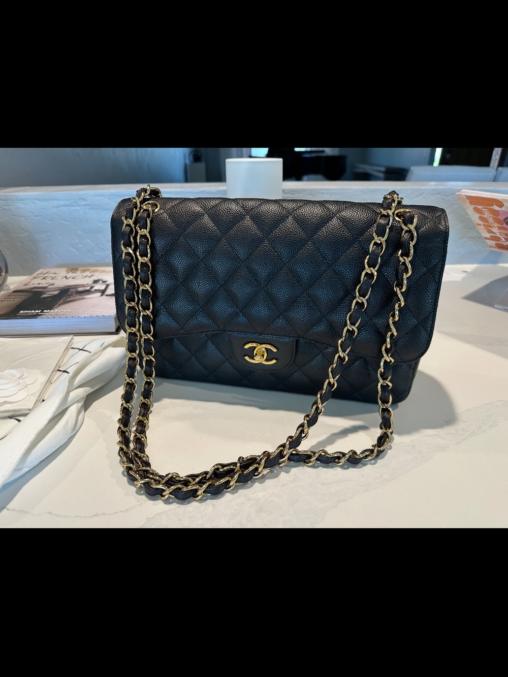 CHANEL Black Quilted Shoulder Bag with Gold Chain and CC Turnlock